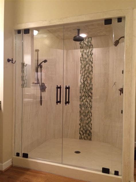 double door steam shower with colonial handles in orb hardware finish frameless shower