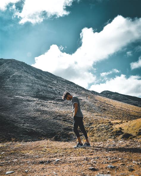 Man Standing Near Mountain · Free Stock Photo
