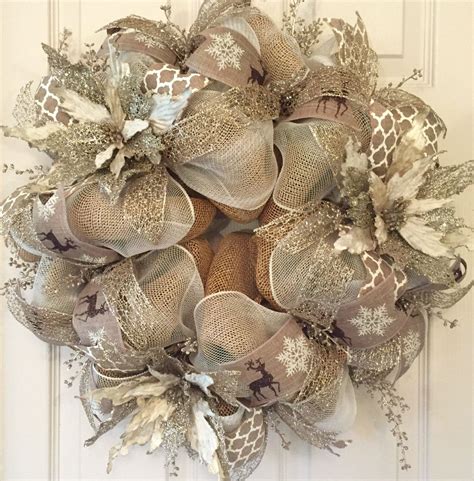 A Wreath Is Hanging On The Door With Deers And Snowflakes Around It
