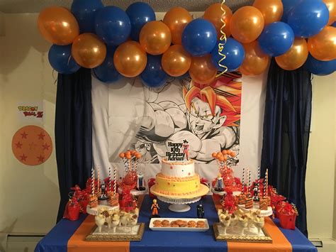 Dragon ball z party with a goku inspire cake, a dessert table with balloons, candies packaged & embellished with stars in orange and blue! Dragon ball Z birthday party | Cake smash pictures, Dragon birthday, Cake smash