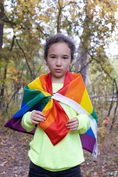 Portrait Of Little Girl With Rainbow Flag Lgbtq Concept Stock Photo