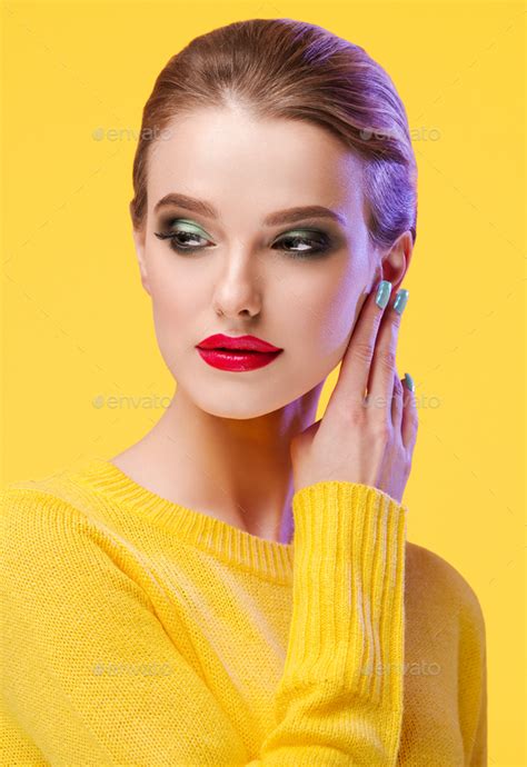 Colorful Makeup Woman In Yellow Clothes On Color Summer Background