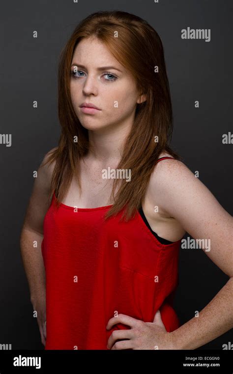 a moody ginger haired freckled skinned 16 17 18 year old slim caucasian teenage british girl