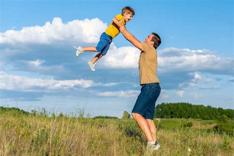 Happy Parent Playing With Child On Grassland Stock Image Image Of