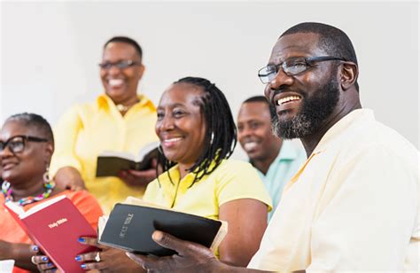 Group Of Mature Black Men And Women Holding Bibles Stock Photo