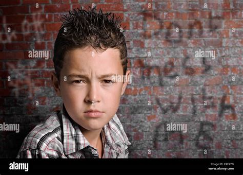 Scowling Mean Looking 11year Old Boy With Spikey Gelled Hair Standing