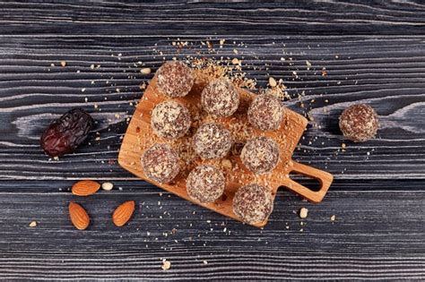 Healthy Homemade Sweets On Dark Wooden Table Top View Energy Balls