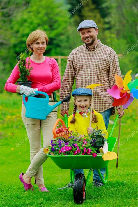 Closed opens sunday at 12:00pm view hours Gardening - happy family with wheelbarrow working in the ...