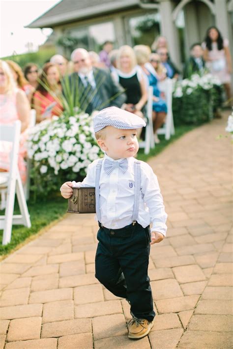 Your ring bearer has two very important jobs on the wedding day: Blue Seersucker Ring Bearer Outfit