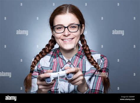Nerd Woman With Braid Playing Videogames With A Joypad Stock Photo Alamy