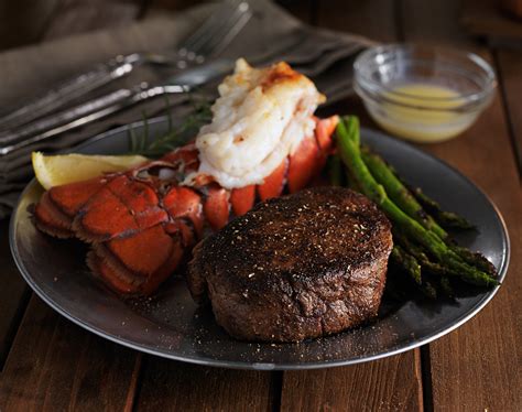 Steak and lobster marble arch is located off oxford street tucked behind selfridges, it is the perfect place for a meal after a long day shopping. steak and lobster dinner in low key lighting - Haub Steakhouse
