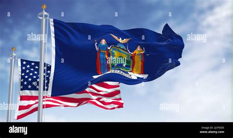 The New York State Flag Waving Along With The National Flag Of The