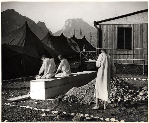 Survivors Dressed In Medical Gowns Use The Latrines Outside The Red Cross Tent In Ebensee