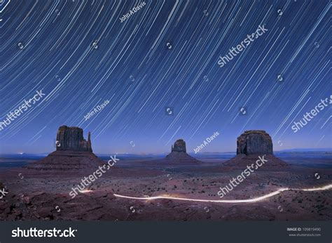 Star Trails In The Night Over The Mitten Rock Formations In Monument