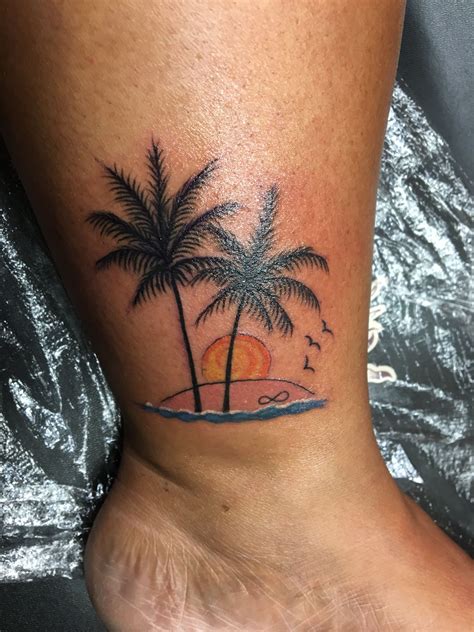 Palm Tree Tattoo With A Beautiful Sunset On A Beach