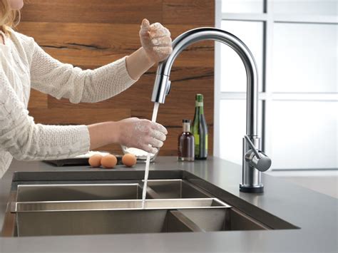 Using a touch activated kitchen faucet gives you convenience. Faucet.com | 9159T-CZ-DST in Champagne Bronze by Delta