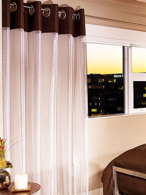 The sheer window treatments add softness to the modern space. Modern Furniture: Beautiful Window Treatments for Bedrooms