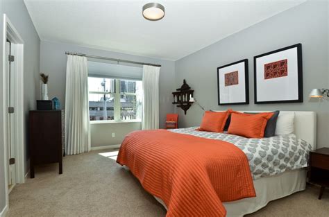 This bedroom design makes sure the room doesn't feel unwelcoming. Pin by ARESI Group on Bathrooms | Grey orange bedroom ...