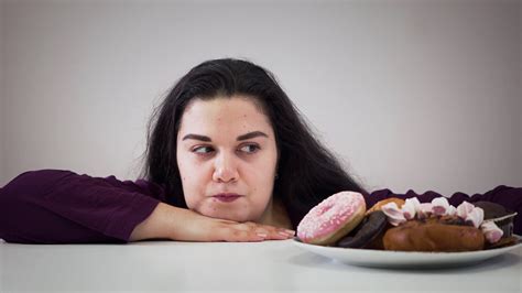 Portrait Of Obese Caucasian Brunette Girl Taking Dessert From Plate And
