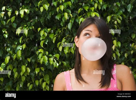 Teenage Girl Blowing A Bubble Gum Stock Photo Alamy