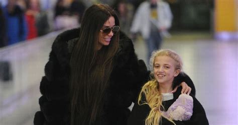 katie price plasters on a grin as she jets off hours after alex reid s sex tape claims mirror