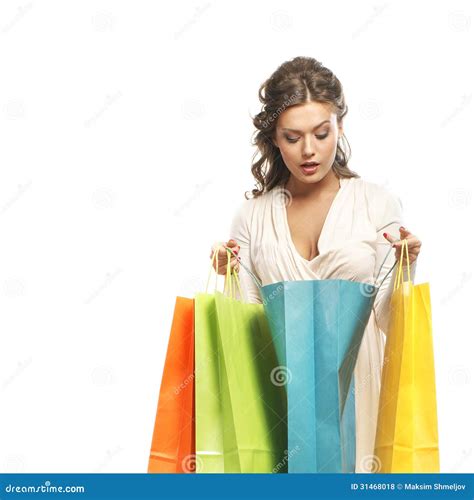 A Young Woman In A Dress Holding Shopping Bags Stock Photo Image Of