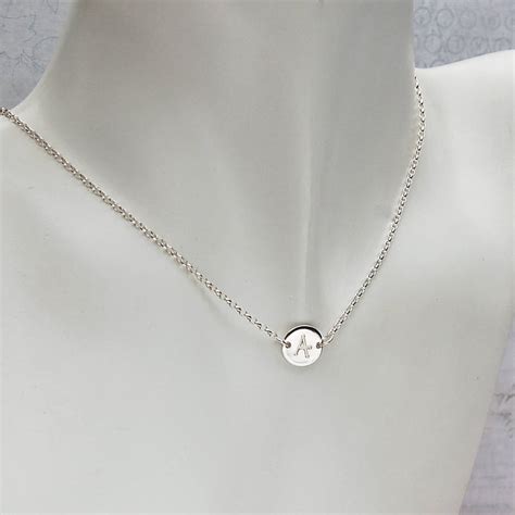 One of the most significant overall trends we are seeing continue into this year is layering. Girls Personalised Initial Silver Disc Necklace By Indivi ...