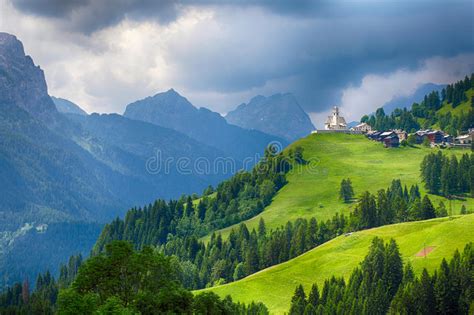 Church In Dolomites Alps Countryside Meadow Mountain Stock Photo