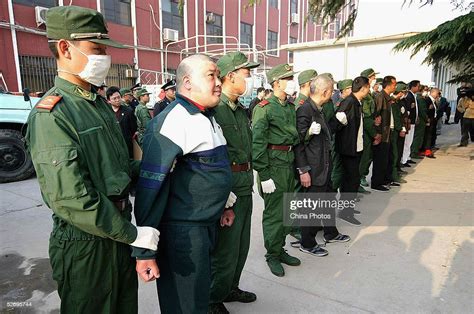 Chinese Police Escort Convicted Criminal Gang Members For Execution