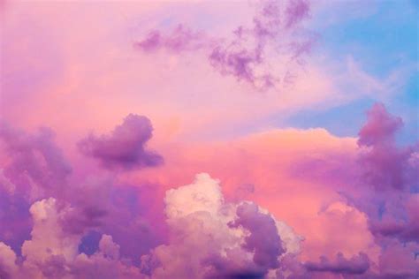 The Sky Is Pink And Blue With White Clouds