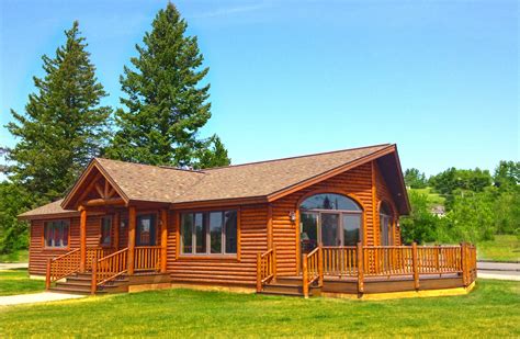 A Little Log Cabin With A Log Truss Covered Porch And