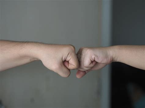 Two Woman Alternative Handshakes Fist Collision Bump Greeting In The