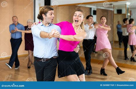 Cheerful Man And Woman Practicing Ballroom Dances In Ballroom Stock Image Image Of Samba