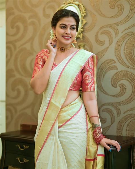 Anusree Nair Looks Divine In An Ivory Set Saree With Red Border