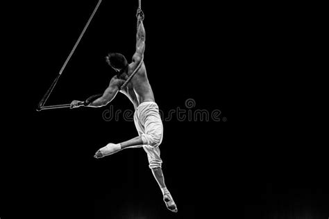 Muscular Male Air Circus Artist Performances With Dance Trapeze Stock