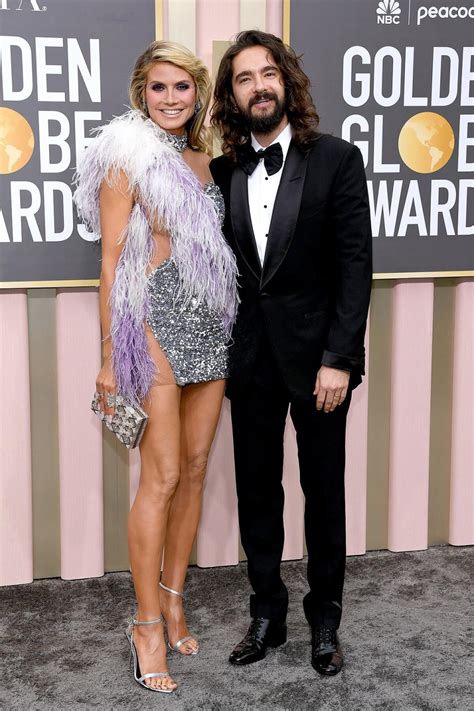 heidi klum takes all the fashion risks at the 2023 golden globes in sheer feathered mini dress