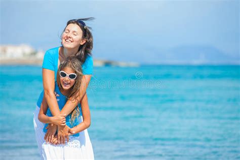 Mother And Her Daughter Having Fun On Beach Stock Image Image Of Happy Little 23891425