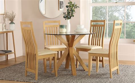 Add style to your small dining room with this round table from havana collection. Hatton Round Oak and Glass Dining Table with 4 Bali Chairs ...