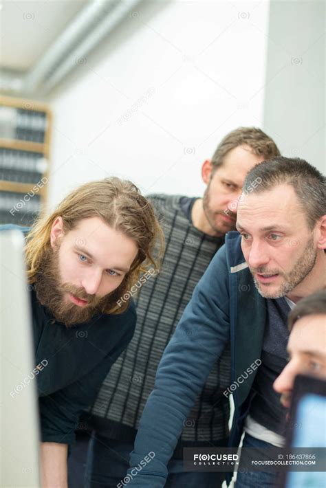 Focused Male Architects Working In Office — Computer Young Adult