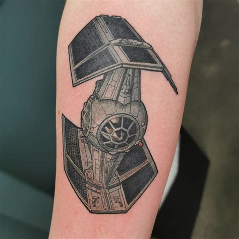 A Star Wars Tattoo On The Arm Of A Person