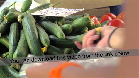 Woman Buying Cucumbers On The Market Youtube