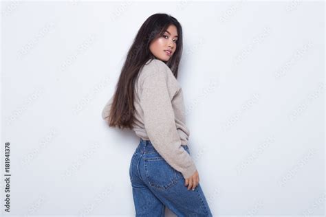 Beautiful And Sexy Attractive Girl In A Sexy Jeans Posing Isolated On