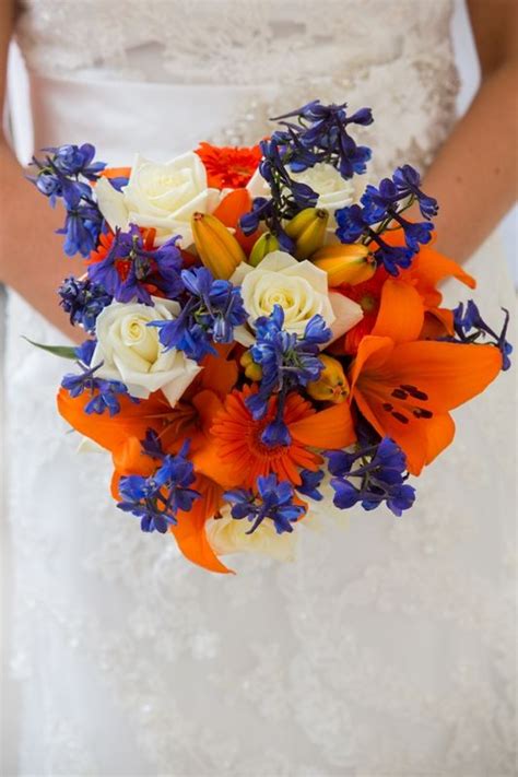 Beautiful decoration of flowers in orange gerber flowers on color background. my bridal bouquet - blue and orange for Mets colors ...
