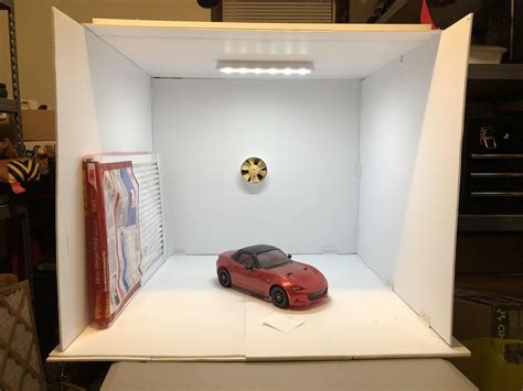 Here's a picture of mine, i made it from preformed corrugated cardboard. DIY spray booth - Build Tips and Techniques - Tamiyaclub.com