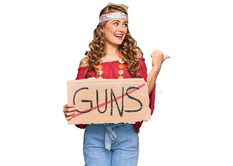Young Blonde Girl Wearing Hippie Style Holding No Guns Warning Banner
