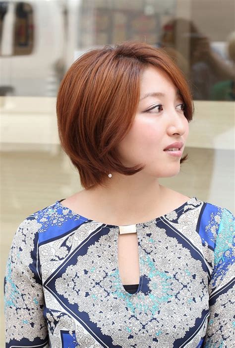 glamorous short warm coppery brown bob with side swept fringe hairstyles weekly