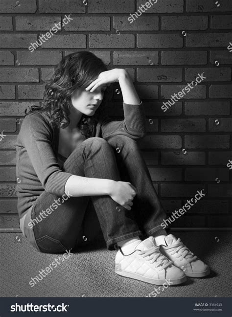Teenage Girl Sitting Against Brick Wall Stock Photo 3364943 Shutterstock