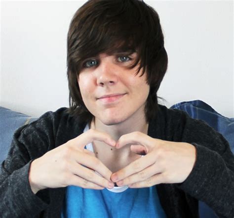 a woman making a heart with her hands