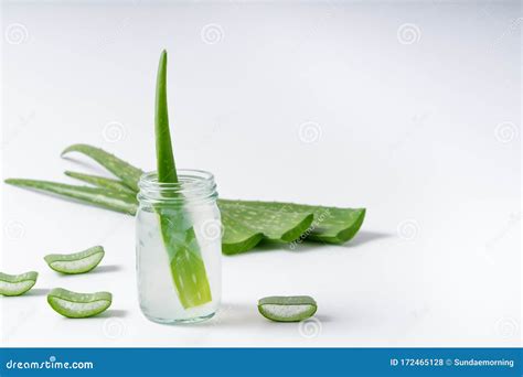 Cut Aloe Vera Stem And Gel In Wooden Bowl On White Background Stock