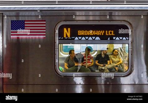 Looking Through A Window Of A New York City Subway Train At People